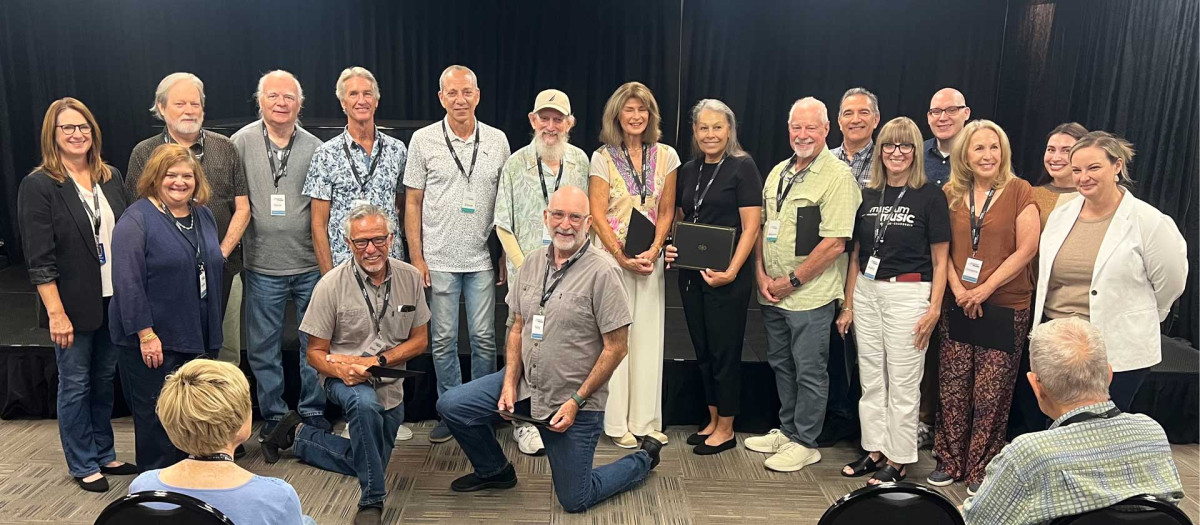 The Museum of Making Music's 2026 volunteer class gathered on stage at their graduation ceremony